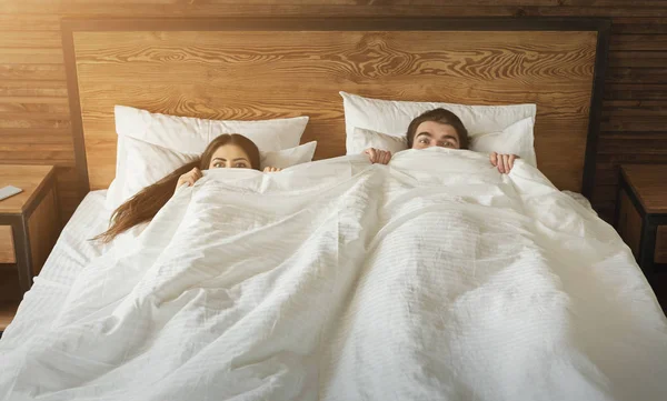 depositphotos 199183218 stock photo shocked man and woman hiding