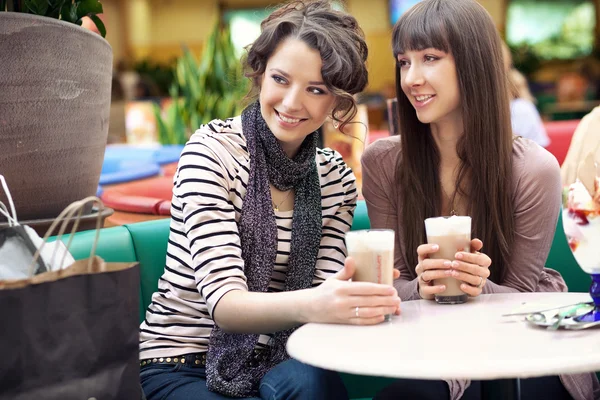 depositphotos 5087551 stock photo two beautiful women drinking coffee